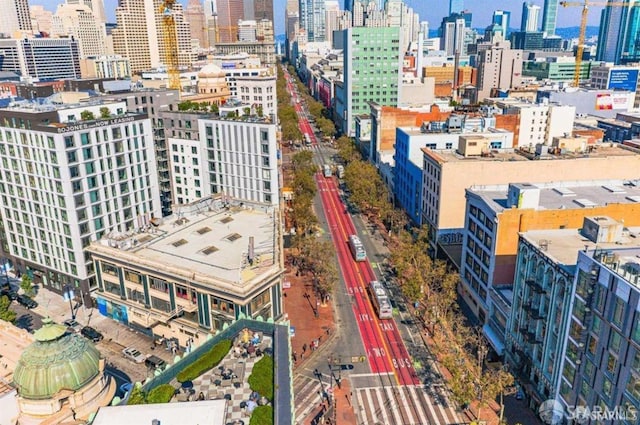 birds eye view of property featuring a city view