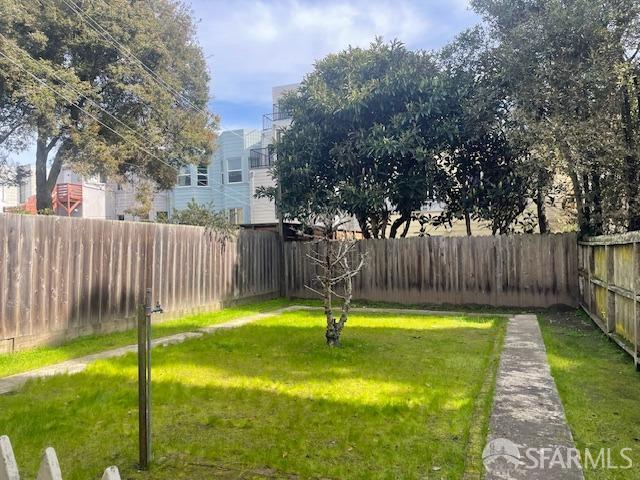 view of yard with a fenced backyard