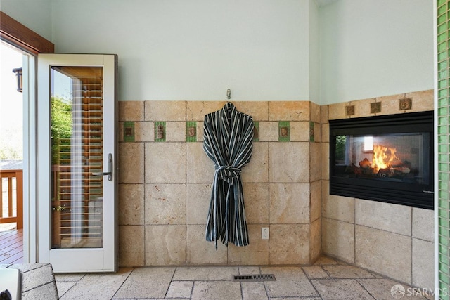 details with visible vents and a tile fireplace