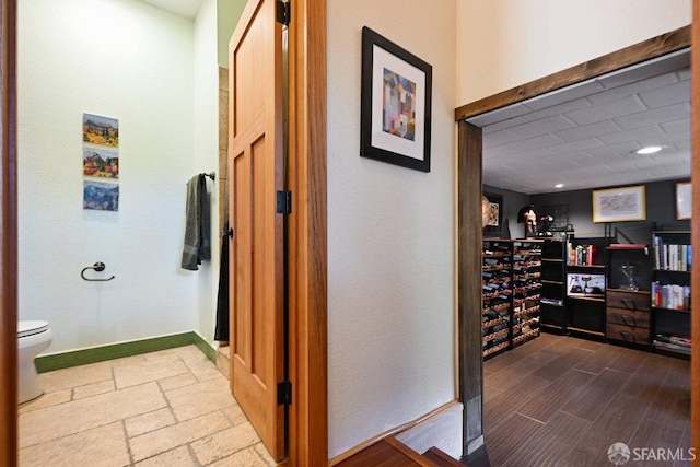 wine area featuring baseboards