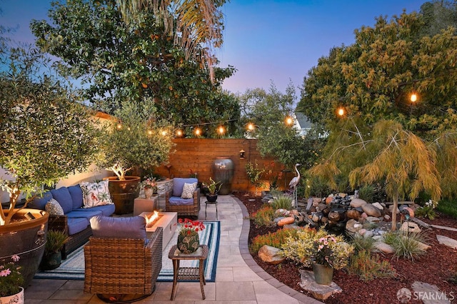 view of patio / terrace featuring fence and an outdoor living space