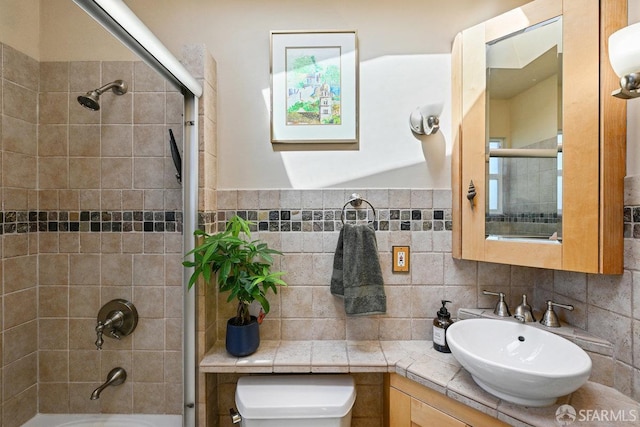 bathroom with vanity, shower / bathtub combination, toilet, and tasteful backsplash