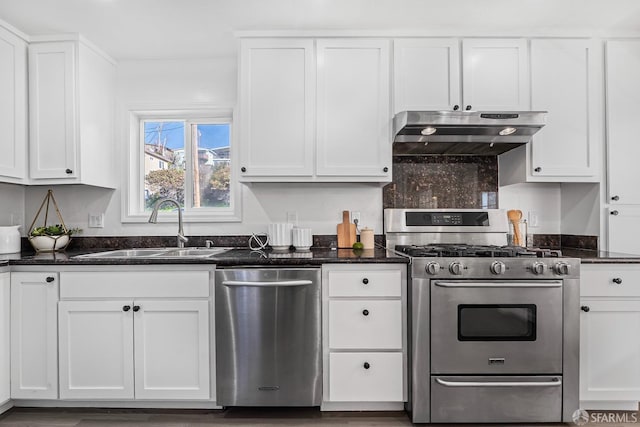 kitchen with sink, white cabinets, and appliances with stainless steel finishes