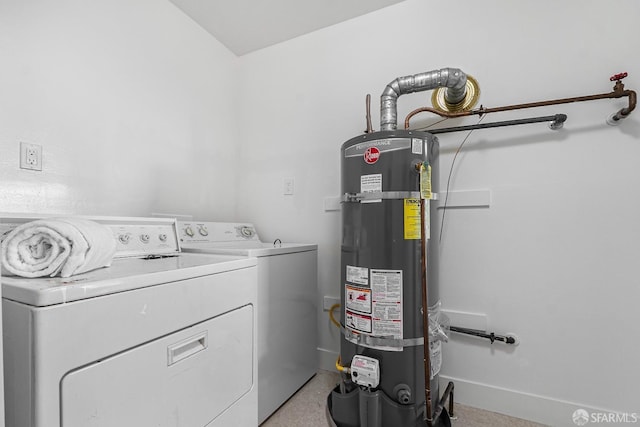 washroom featuring washer and dryer and secured water heater