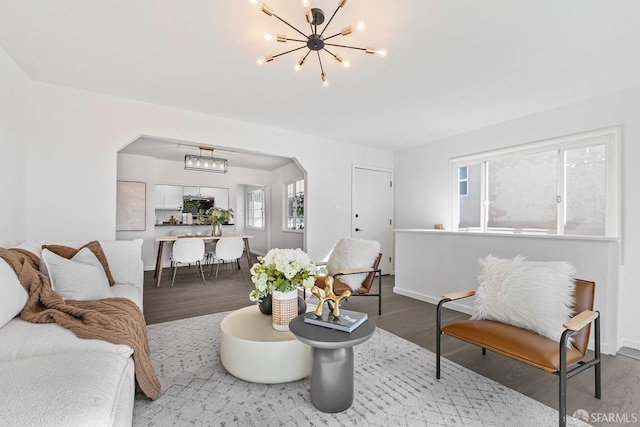 living room featuring light hardwood / wood-style flooring and a chandelier