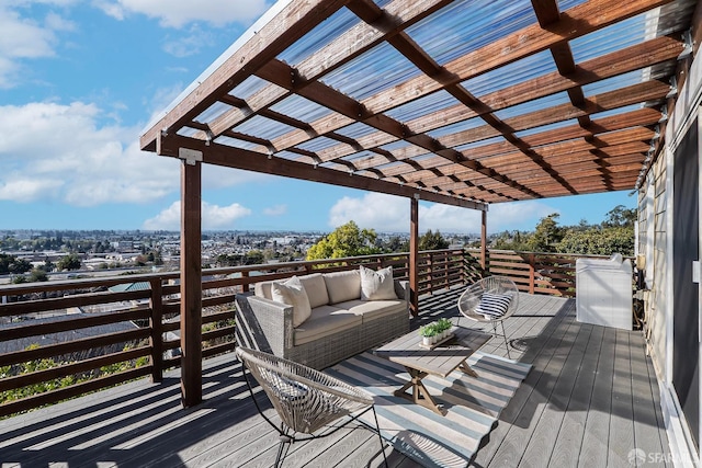 wooden terrace with outdoor lounge area and a pergola