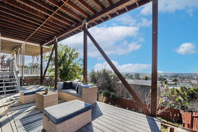 wooden deck with an outdoor living space