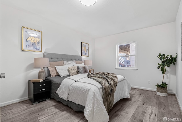 bedroom with light hardwood / wood-style floors