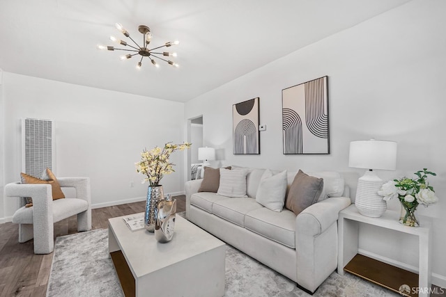 living room featuring a chandelier and light hardwood / wood-style floors