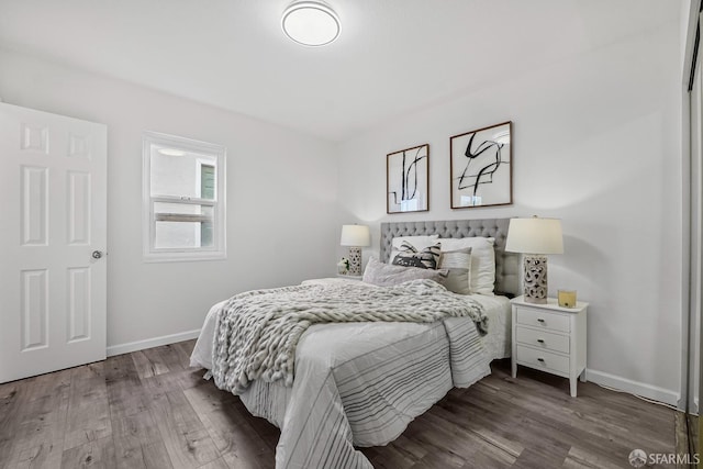 bedroom with hardwood / wood-style floors