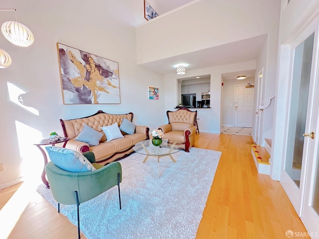 1951 Ofarrell St Unit 420, San Mateo, CA 94403 - living room with light wood-style flooring and baseboards