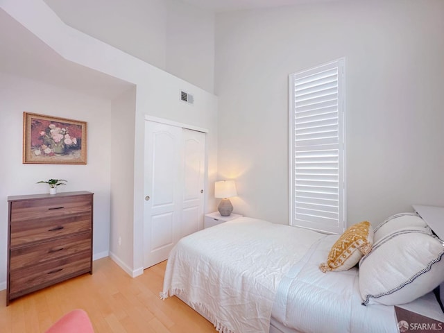 1951 Ofarrell St Unit 420, San Mateo, CA 94403 - bedroom with light wood finished floors, a closet, and a high ceiling