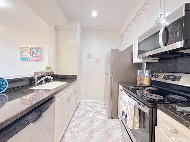 1951 Ofarrell St Unit 420, San Mateo, CA 94403 - kitchen with appliances with stainless steel finishes, dark stone counters, white cabinets, and recessed lighting