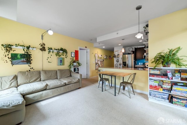 living area with light carpet