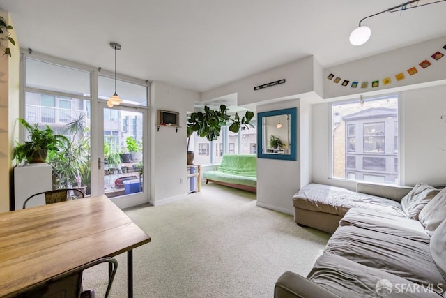 living room with carpet floors and baseboards