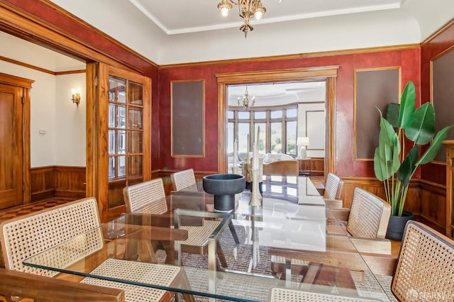 3011 Van Ness Ave, San Francisco, CA 94109 - dining room featuring a chandelier, a wainscoted wall, wood walls, and wood finished floors