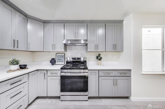 95 Olmsted Ct, Pittsburg, CA 94565 - kitchen with stainless steel gas range, gray cabinets, and under cabinet range hood