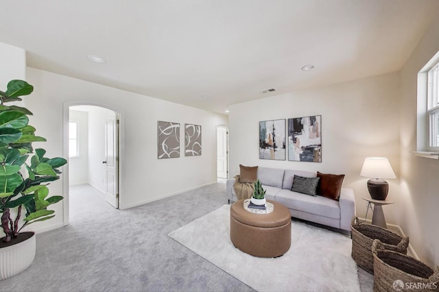 95 Olmsted Ct, Pittsburg, CA 94565 - carpeted living room featuring arched walkways, plenty of natural light, and recessed lighting