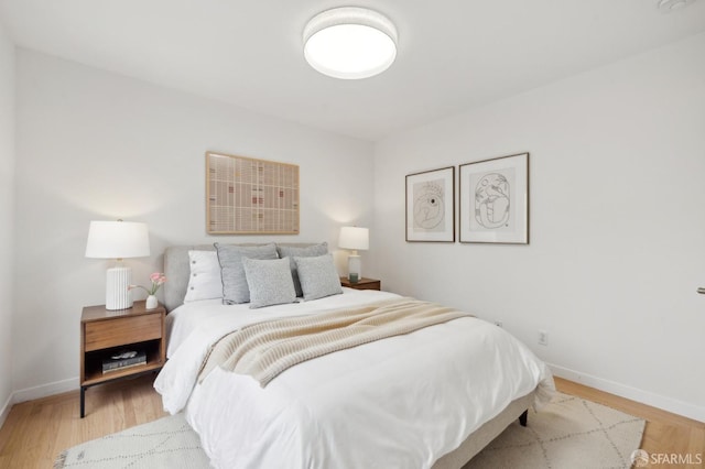 bedroom with light wood-type flooring