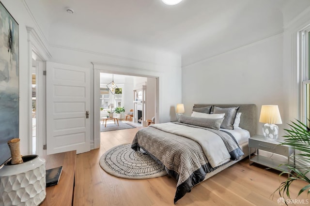 291 Church St, San Francisco, CA 94114 - bedroom with light wood-type flooring and ornamental molding