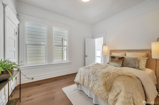 291 Church St, San Francisco, CA 94114 - bedroom featuring wood finished floors and multiple windows