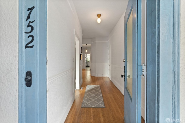 hall with dark hardwood / wood-style flooring