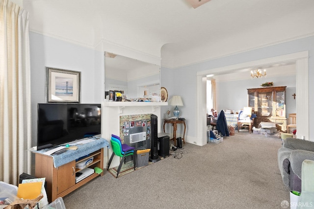 living room with a chandelier and carpet flooring