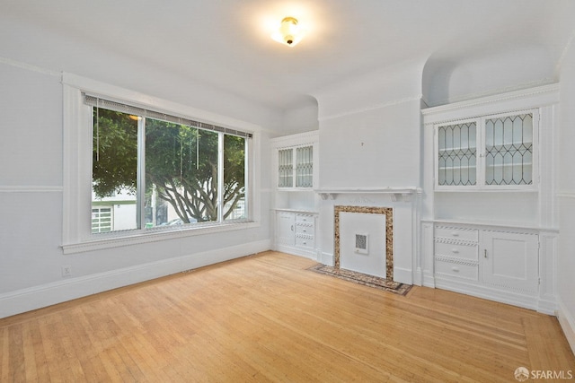 unfurnished living room featuring wood-type flooring