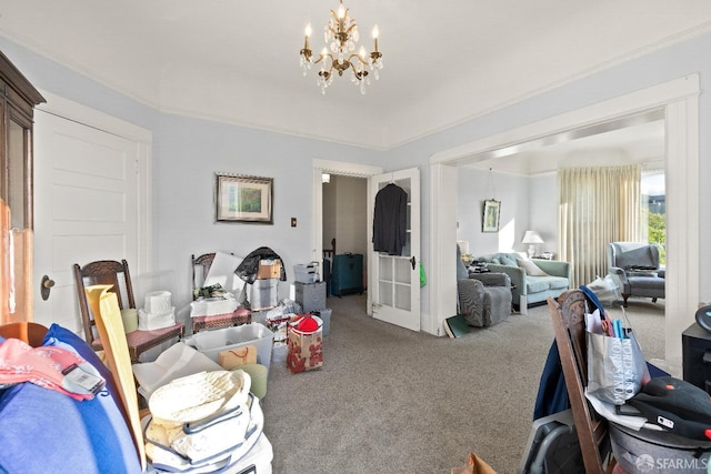 living room featuring an inviting chandelier and carpet floors