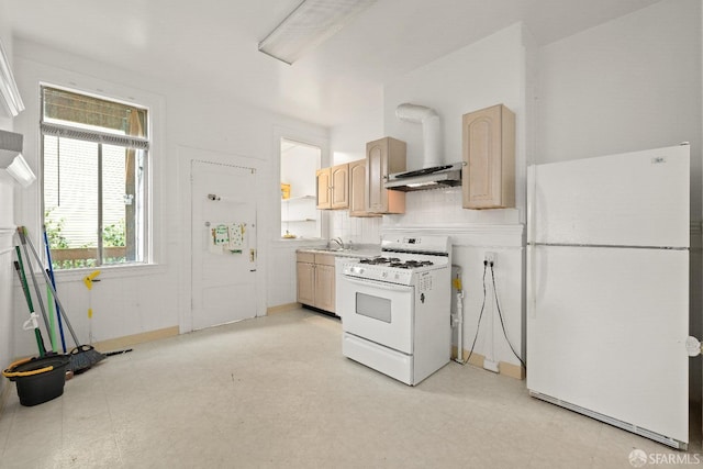 kitchen with tasteful backsplash, white appliances, light brown cabinetry, and wall chimney range hood