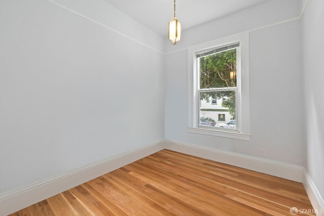 spare room with hardwood / wood-style flooring