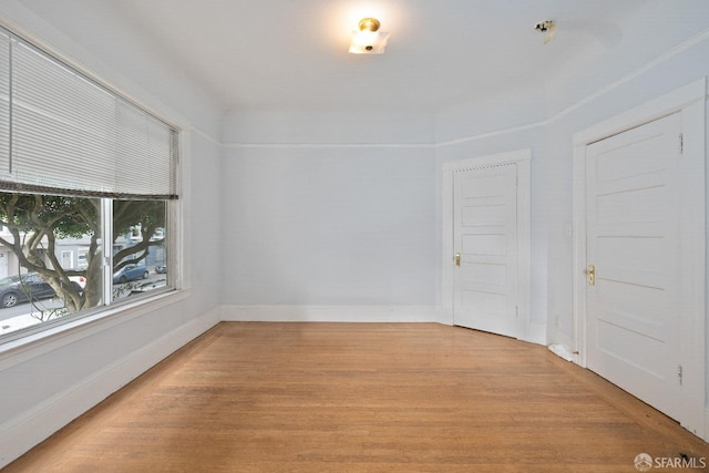 spare room with light wood-type flooring