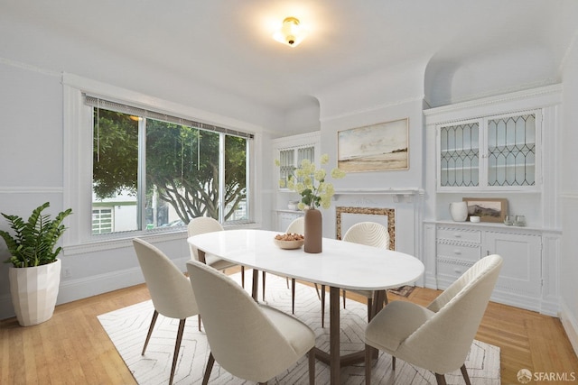 dining space with light hardwood / wood-style floors