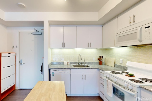 kitchen with dark wood-type flooring, backsplash, sink, white cabinetry, and white appliances