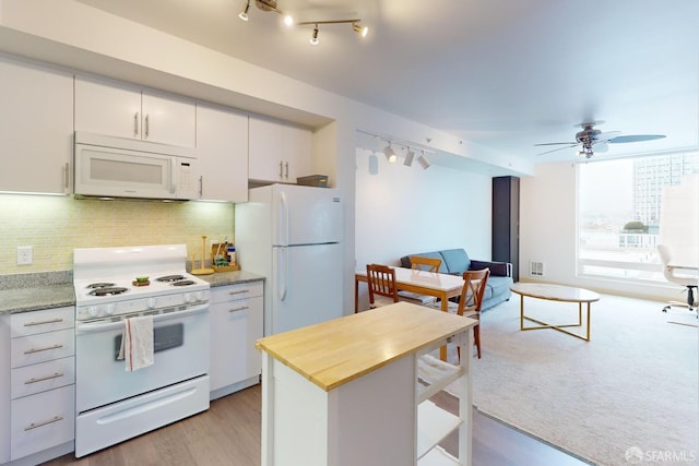 kitchen featuring light hardwood / wood-style floors, white cabinetry, ceiling fan, and white appliances