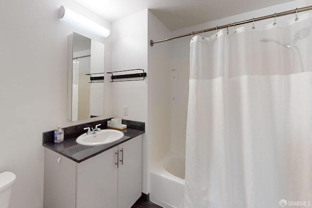 full bathroom with vanity, shower / bath combo with shower curtain, and toilet