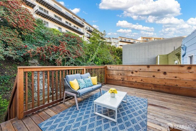 wooden terrace with outdoor lounge area