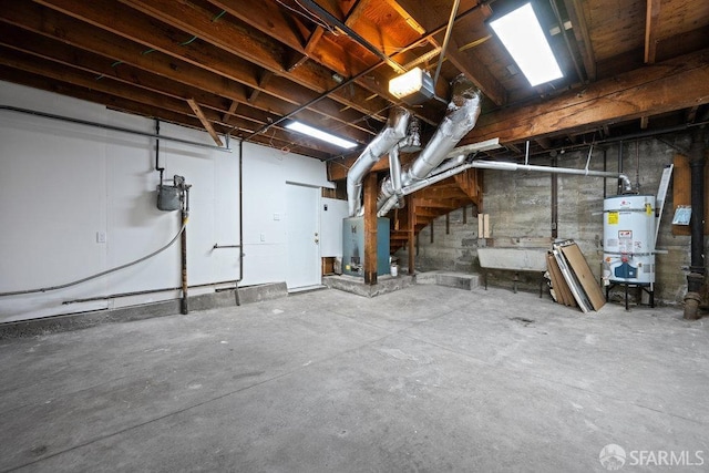 unfinished basement featuring secured water heater and a sink