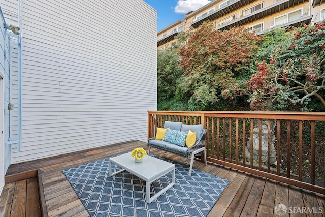 wooden deck featuring an outdoor living space