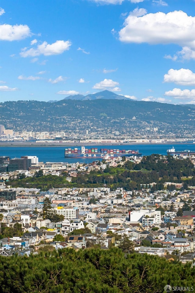 aerial view with a view of city and a mountain view