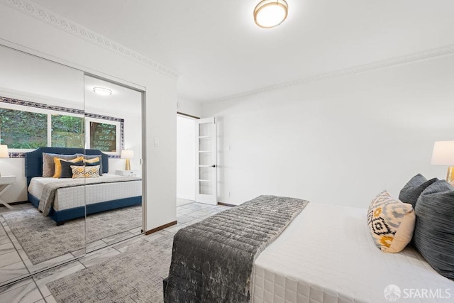 bedroom with ornamental molding