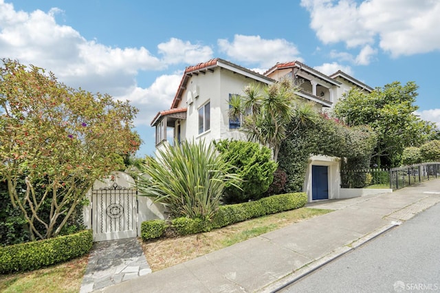 1475 Monterey Blvd, San Francisco, CA 94127 - view of front of home featuring a gate, stucco siding, and a tiled roof
