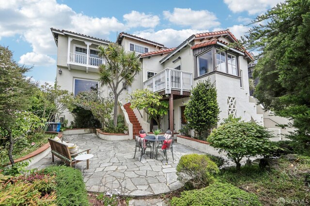1475 Monterey Blvd, San Francisco, CA 94127 - back of house featuring a patio area, a tiled roof, stairs, and stucco siding
