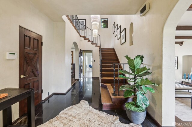 1475 Monterey Blvd, San Francisco, CA 94127 - entryway with arched walkways, granite tiled floors, stairway, and baseboards