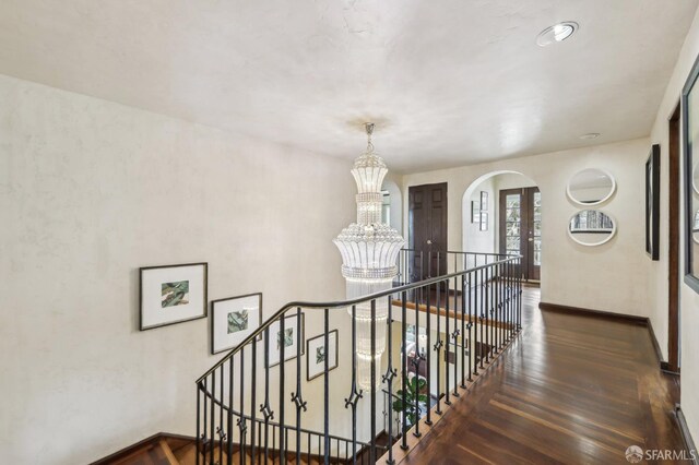 1475 Monterey Blvd, San Francisco, CA 94127 - stairs with a chandelier, wood finished floors, arched walkways, and baseboards