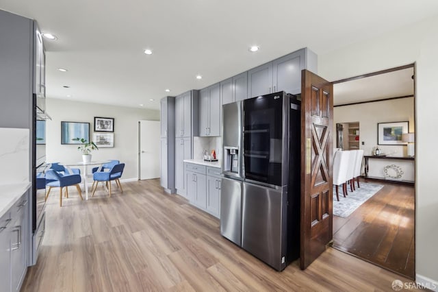 1475 Monterey Blvd, San Francisco, CA 94127 - kitchen featuring stainless steel fridge with ice dispenser, gray cabinetry, light wood-type flooring, light countertops, and recessed lighting