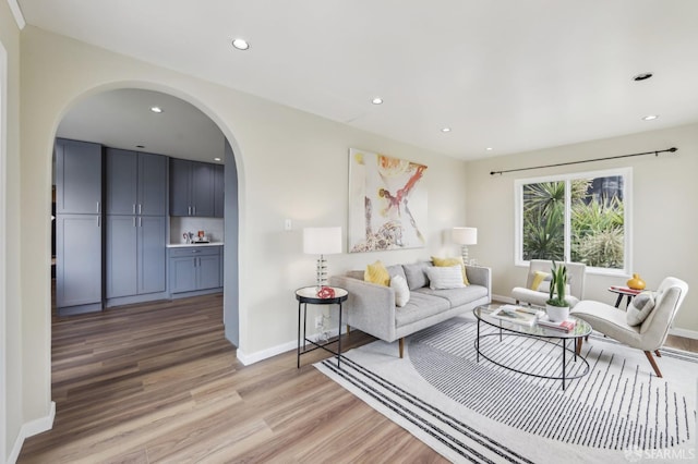1475 Monterey Blvd, San Francisco, CA 94127 - living room featuring arched walkways, light wood-style flooring, recessed lighting, and baseboards