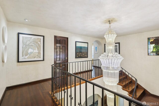 1475 Monterey Blvd, San Francisco, CA 94127 - corridor featuring an upstairs landing, a chandelier, wood finished floors, and baseboards