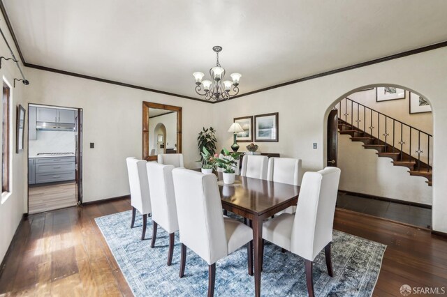 1475 Monterey Blvd, San Francisco, CA 94127 - dining room featuring arched walkways, hardwood / wood-style floors, a chandelier, ornamental molding, and stairway
