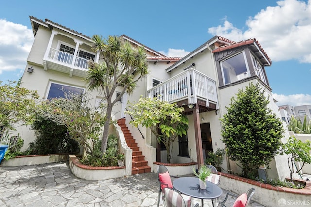 1475 Monterey Blvd, San Francisco, CA 94127 - rear view of property with stucco siding, a patio, stairway, a tile roof, and a balcony